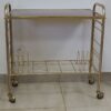 meuble-tv-dessus-formica-marron-pietement-metal-couleur-laiton-range-revues