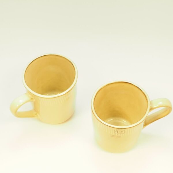 lot 2 mugs beige n'kuku-vu de dessus